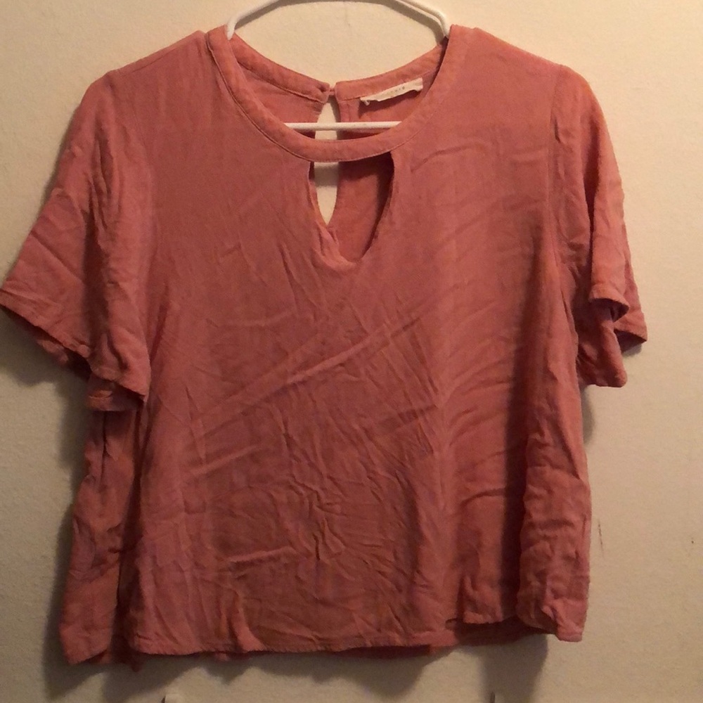 This is a cute pink crop shirt.